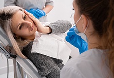 Dentist treats patient