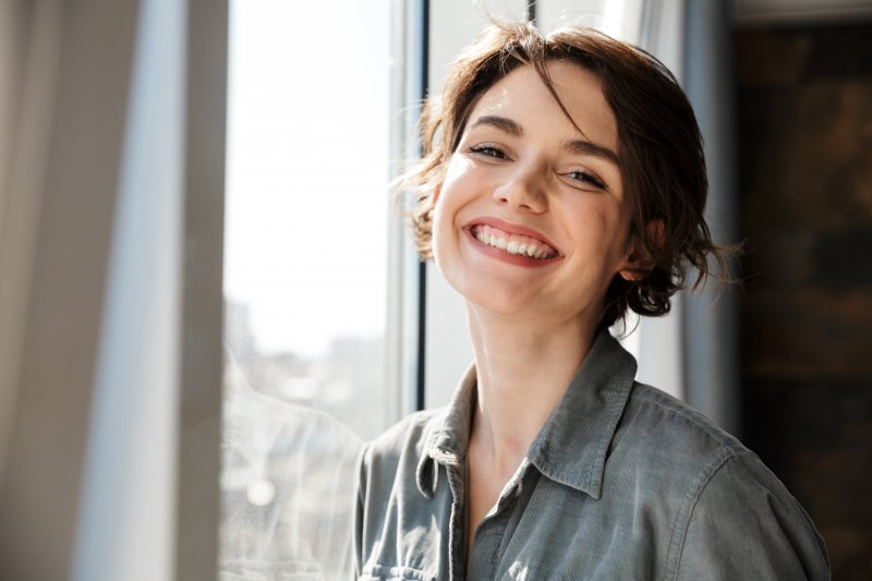 person with dental implants smiling